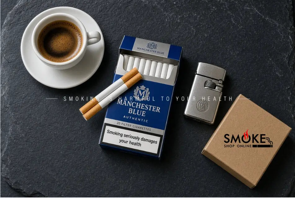 Overhead flatlay of authentic Manchester Blue cigarette pack beside an espresso cup and brass lighter